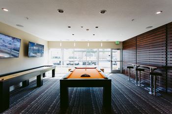 Game room with pool table and shuffle board